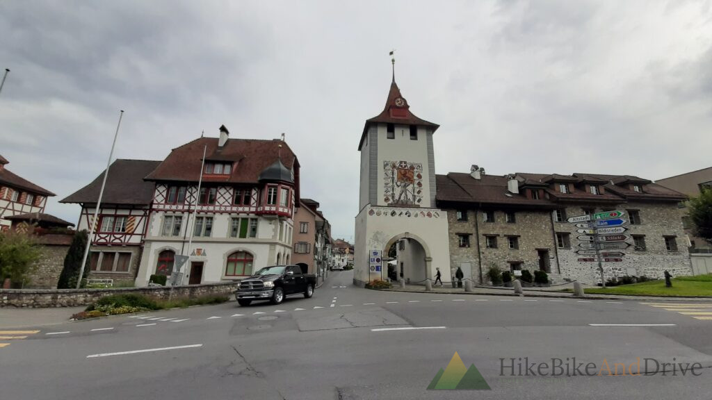 Old town gate with a clock tower in a Swiss town