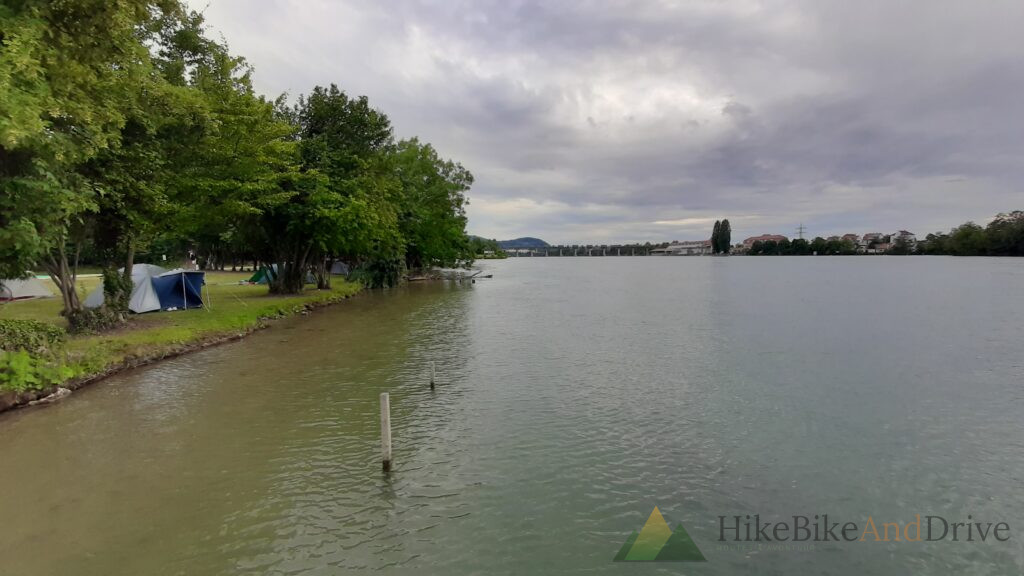Wide Rhine river under grey skies at the campsite
